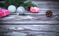 Christmas wooden background with fir tree, gifts boxes, pine cones and christmas balls, view with copy space Royalty Free Stock Photo