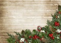 Christmas wooden background with poinsettia, holly and fir branches Royalty Free Stock Photo