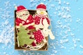 christmas wooden decorative figures in gift box on blue background Royalty Free Stock Photo