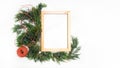 Christmas wooden frame juniper rope and red candle white background top view Royalty Free Stock Photo