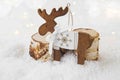 Christmas wooden reindeer ornament on snow Royalty Free Stock Photo