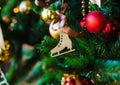 Christmas wooden toy in the form of a figure skate Royalty Free Stock Photo