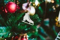 Christmas wooden toy in the form of a figure skate hanging on a Christmas tree Royalty Free Stock Photo