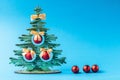 Christmas wooden tree and christrmas balls on blue background.Christmas decoration Royalty Free Stock Photo