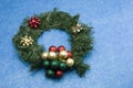 Christmas wreath on blue bkgd Royalty Free Stock Photo