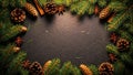 Christmas wreath border with pine cones and cinnamon sticks on dark background Royalty Free Stock Photo