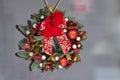 Christmas wreath of branches of a Christmas tree, white,gold and red balls,cinnamon,bow,red berries,poinsettia flower, isolatade. Royalty Free Stock Photo