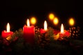 Christmas wreath with burning red candles, advent time Royalty Free Stock Photo