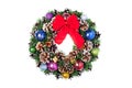 Christmas wreath with cones and Christmas toys and a red bow. Royalty Free Stock Photo