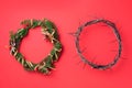 Christmas wreath and crown of thorns on red background. Remember the real Reason of the Season. Christian Christmas and Royalty Free Stock Photo