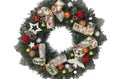 Christmas wreath decorating the front door for the holidays made of spruce, silver bows, stars and Christmas balls Royalty Free Stock Photo