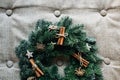 Christmas wreath with decoration cinnamon on grey Royalty Free Stock Photo