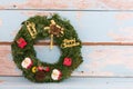 Christmas wreath decoration on retro grunge blue wooden background Royalty Free Stock Photo