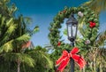 Christmas wreath decoration on a street lamp post in Key West, Florida. Royalty Free Stock Photo