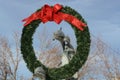 Christmas wreath on Dolphin statue