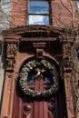 Christmas Wreath on the Entrance Door to an Old Brownstone Townhouse in New York City