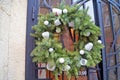 Christmas wreath of fir branches decorated with colorful Christmas balls Royalty Free Stock Photo