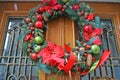 Christmas wreath of fir branches decorated with colorful Christmas balls Royalty Free Stock Photo