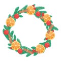 Christmas wreath of fir branches decorated with dried oranges, cinnamon sticks and cardamom