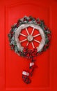 Christmas wreath with fir cones on red background. Top View Royalty Free Stock Photo