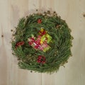 Christmas wreath of fir on a wooden background