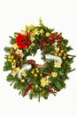 Christmas wreath with flowers and Christmas jewelery, ribbons an Royalty Free Stock Photo