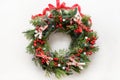 Christmas wreath of fresh natural spruce branch with red holly berries and decoration. New Year. Xmas holiday. Royalty Free Stock Photo