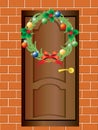 Christmas wreath and the front door. Royalty Free Stock Photo