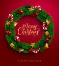 Christmas wreath greeting vector design. Merry christmas text fir leaves branches element with candy cane, bells and balls. Royalty Free Stock Photo