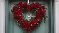 christmas wreath with heart A heart shaped wreath of red roses with green leaves and stems. The roses are fresh and fragrant, Royalty Free Stock Photo