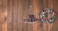 christmas wreath and ice skates on wooden wall Royalty Free Stock Photo