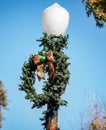 Close up of of a Christmas Wreath on a light post