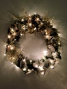 Christmas wreath with lights flowers and birds. Royalty Free Stock Photo