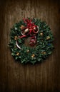 Christmas wreath made with cocktail napkins, wine corks, bottle caps, and drink glasses Royalty Free Stock Photo