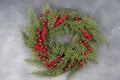 Christmas Wreath Made of Naturalistic Looking Pine Branches Decorated with Winter Berries