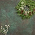 Christmas wreath with pine cones and white flowers Royalty Free Stock Photo