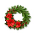 Christmas wreath from pine twigs, berries and poinsettia flowers