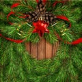 Christmas wreath with pine twigs, cones and red silk ribbon bow Royalty Free Stock Photo