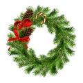 Christmas wreath from pine twigs with red silk ribbon bow, sweet stick, pines and decorative balls