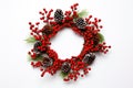 A Christmas wreath with red berries and pine cone, with a white background. Generative AI