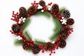 A Christmas wreath with red berries and pine cone, with a white background. Generative AI