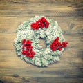 Christmas wreath with red berries. Vintage decoratio Royalty Free Stock Photo