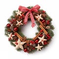 Christmas Wreath with Red Berries, Wooden Stars and Candy Canes on white background Royalty Free Stock Photo