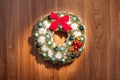 Christmas wreath with a red bow and Christmas toys balls. Royalty Free Stock Photo