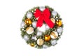 Christmas wreath with a red bow and Christmas toys balls. Royalty Free Stock Photo
