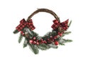 Christmas wreath with red bows, fir branches and red berries Royalty Free Stock Photo