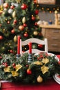 Christmas wreath with red candles on the table in the living room or dining room Royalty Free Stock Photo