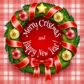 Christmas wreath on a red plaid background Royalty Free Stock Photo