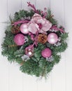 Christmas wreath on a rustic wooden front door. Royalty Free Stock Photo