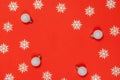Christmas wreath. Silver balls, white snowflakes in shape frame on red background for greeting card. Flat lay, top view, copy Royalty Free Stock Photo